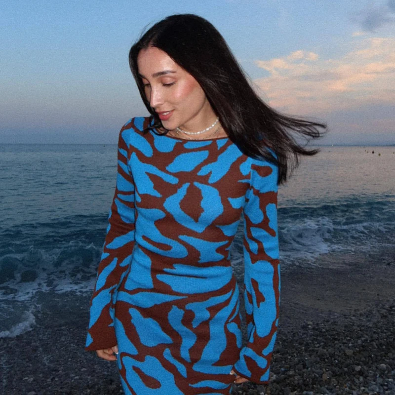 Ava Jacquard Knit Midi Dress" can be rewritten as "Ava Jacquard Knit Mid-Length Dress.